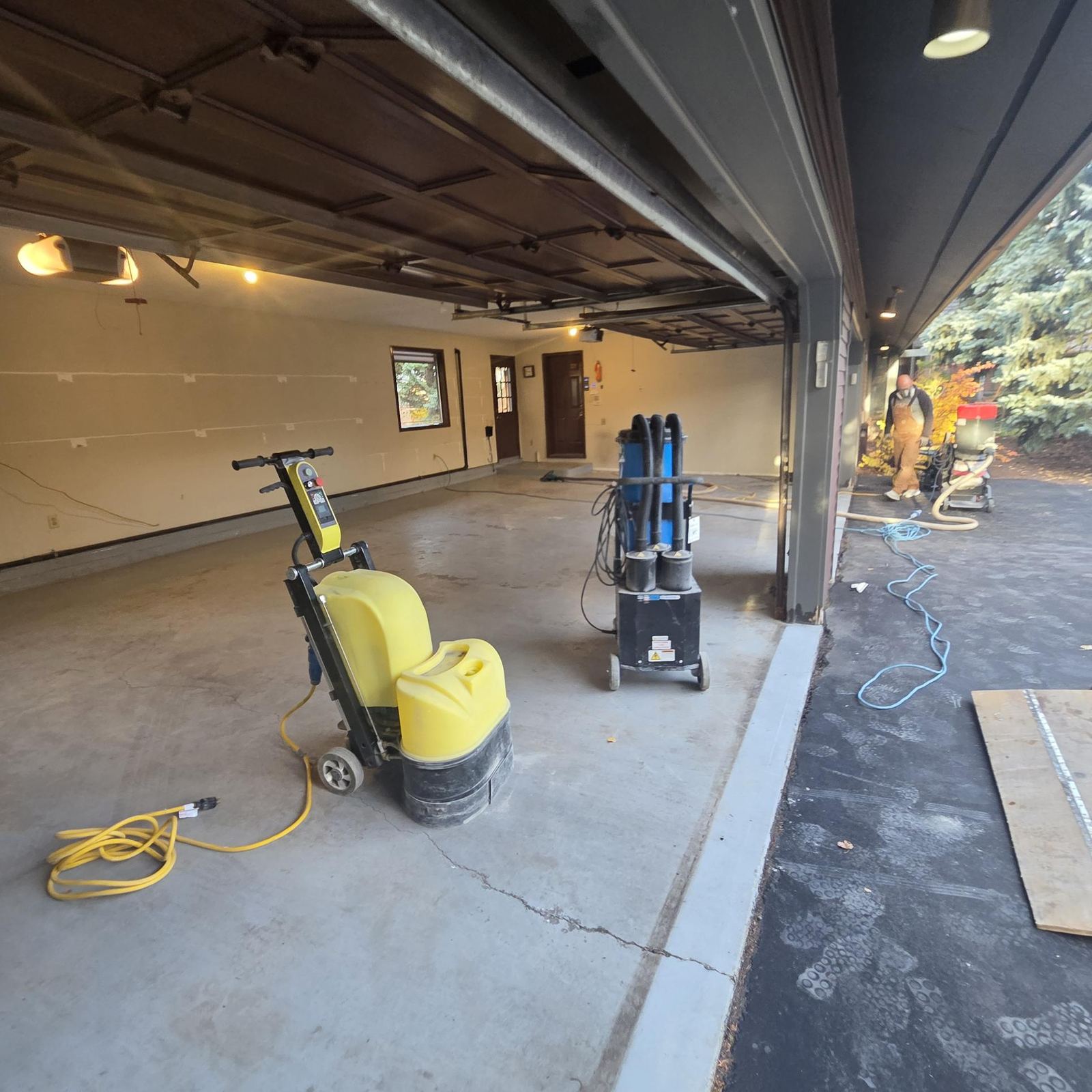 Diamond grinder and HEPA vacuum ready for surface prep