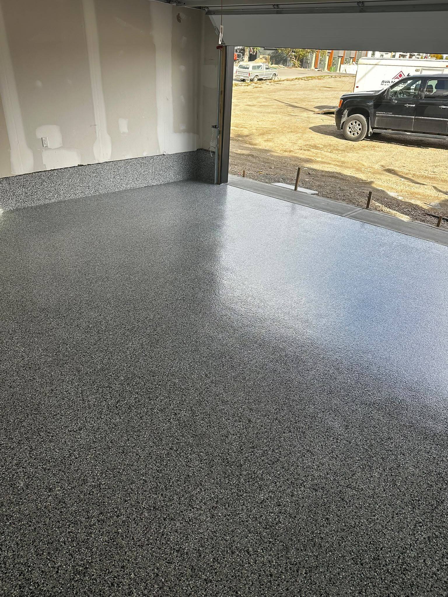 Finished grey flake garage floor with cove base