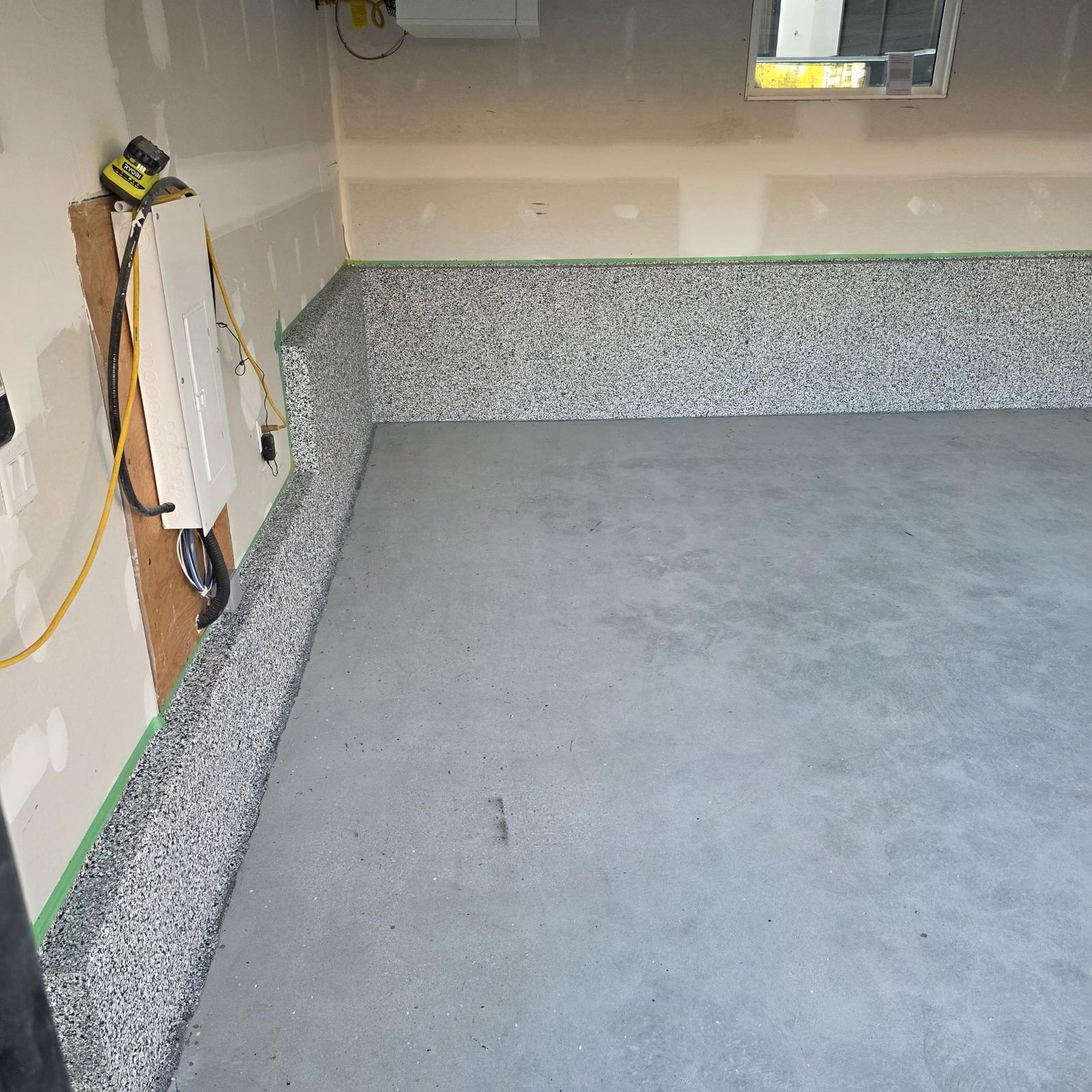 Cove base installed, floor awaiting coating