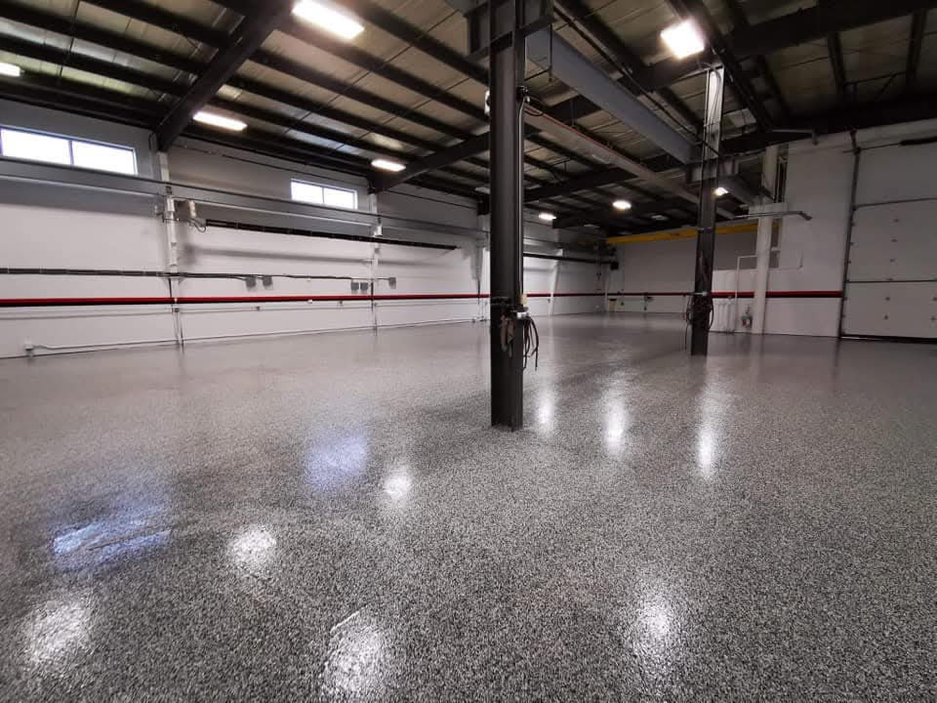 Commercial warehouse with completed flake epoxy floor system by Res-Tech Concrete Calgary
