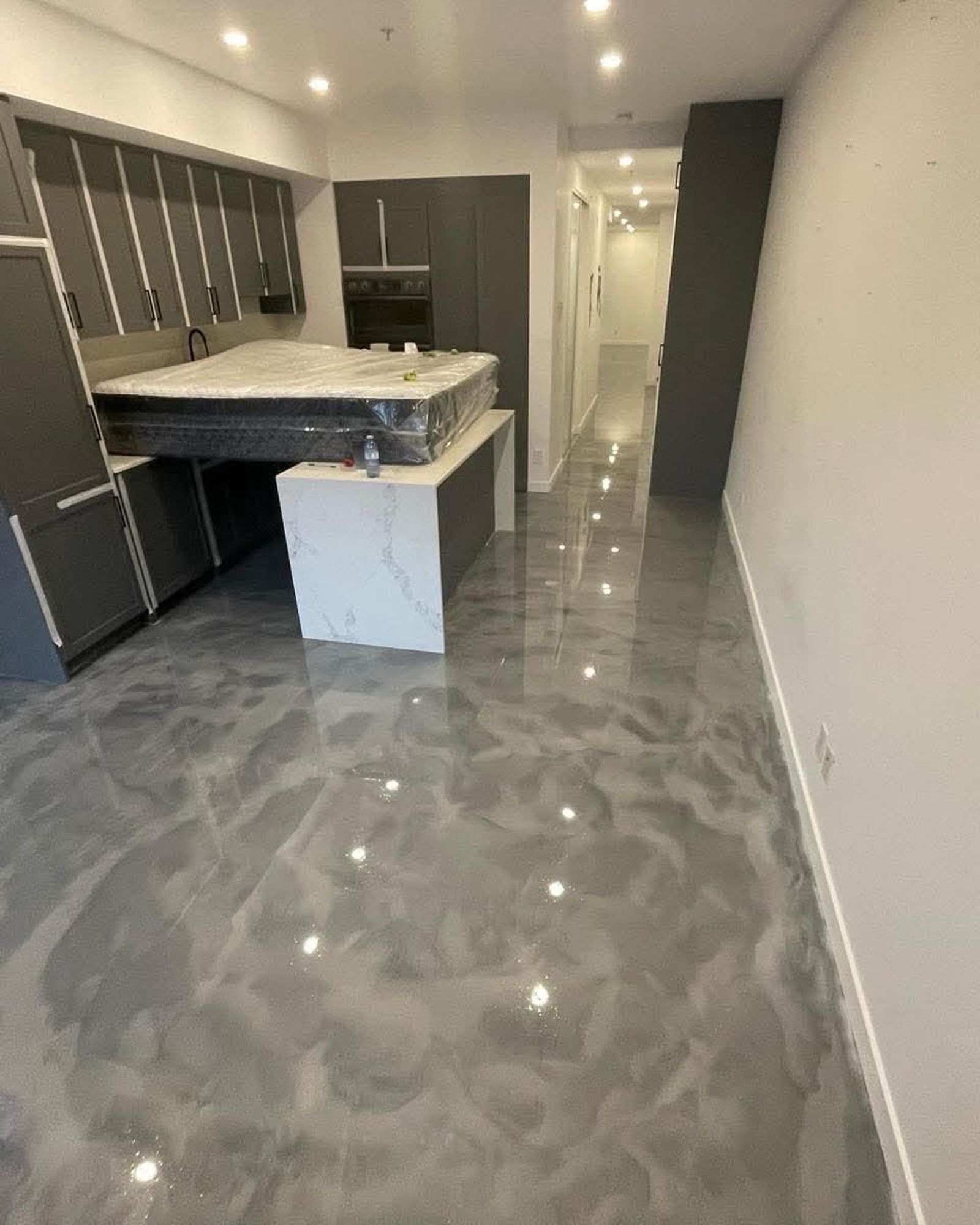 Metallic pearl silver epoxy floor in finished basement suite