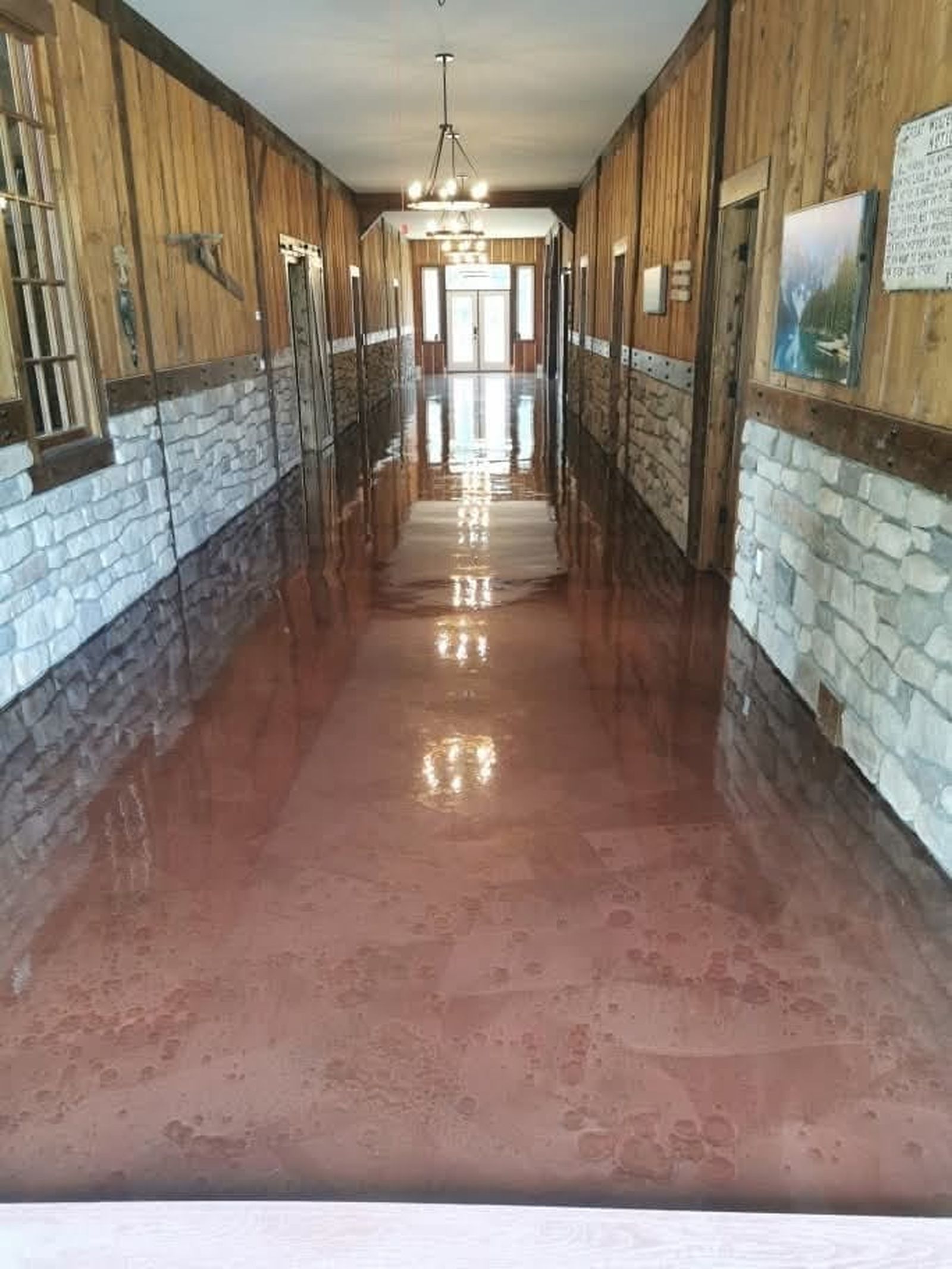 Metallic copper bronze epoxy floor in heritage community hall hallway
