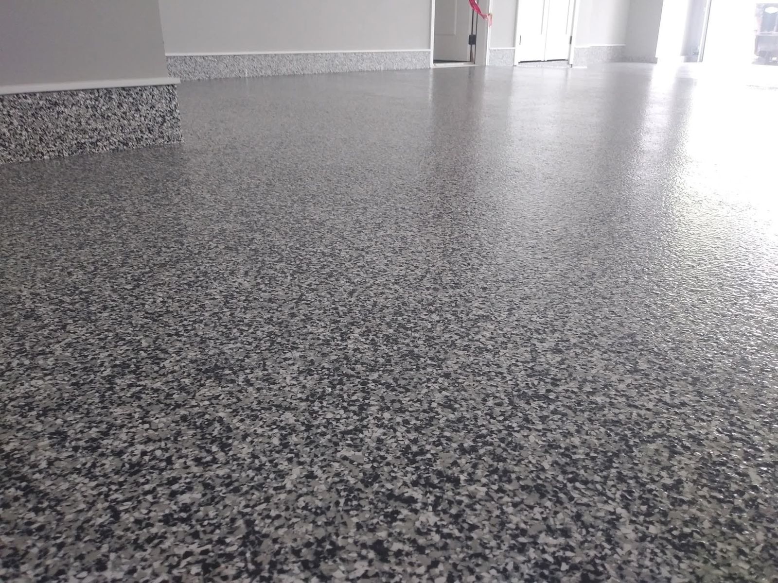 Large garage with flake floor and matching coated pony wall