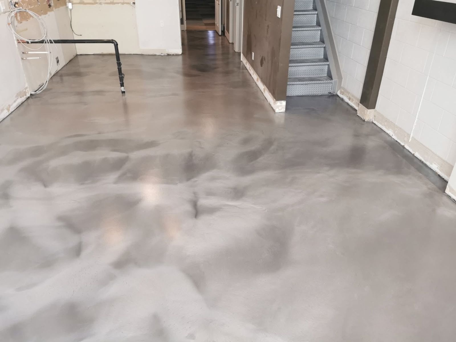 Metallic pewter grey marble epoxy floor in residential basement