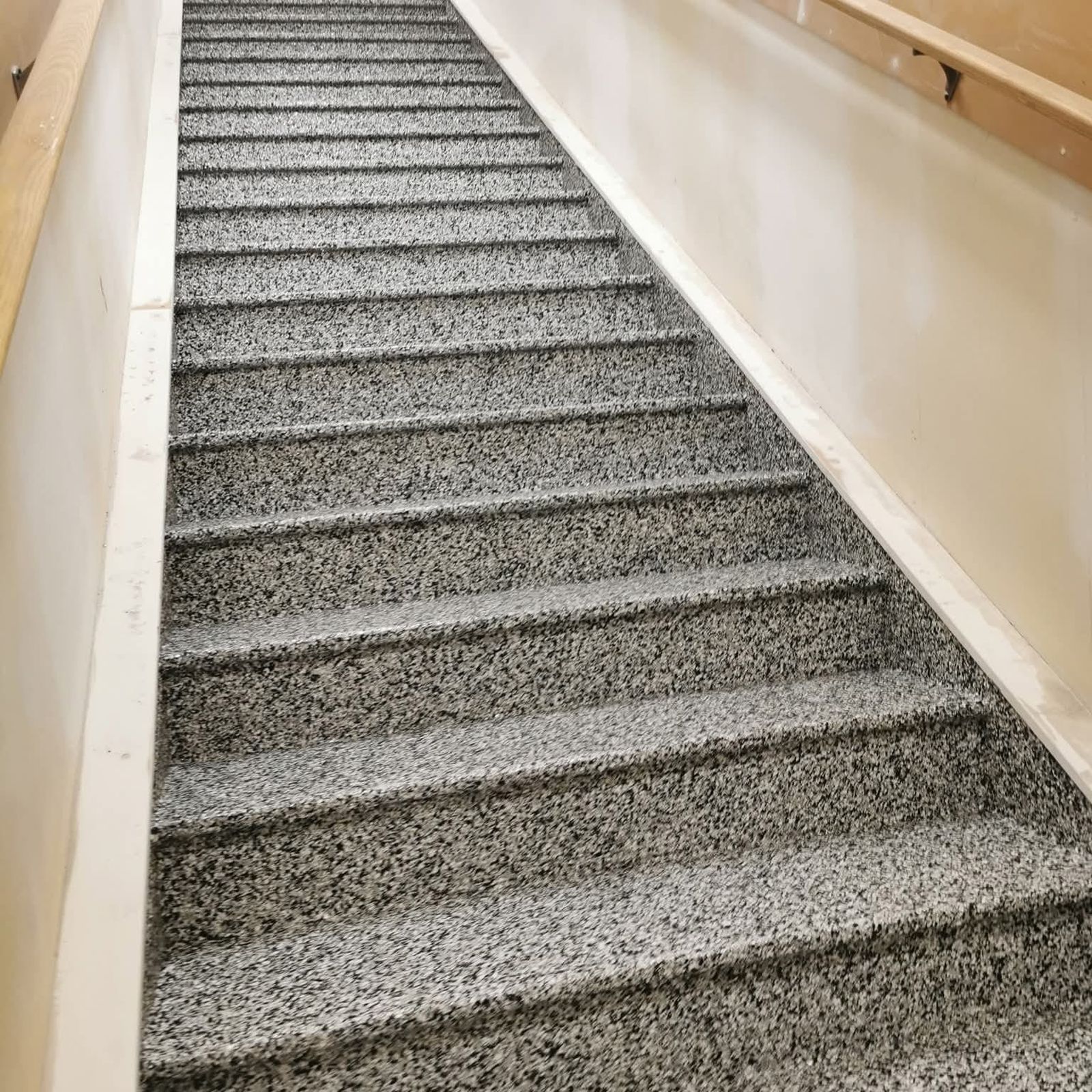 Flake epoxy coating applied to basement staircase for slip resistance