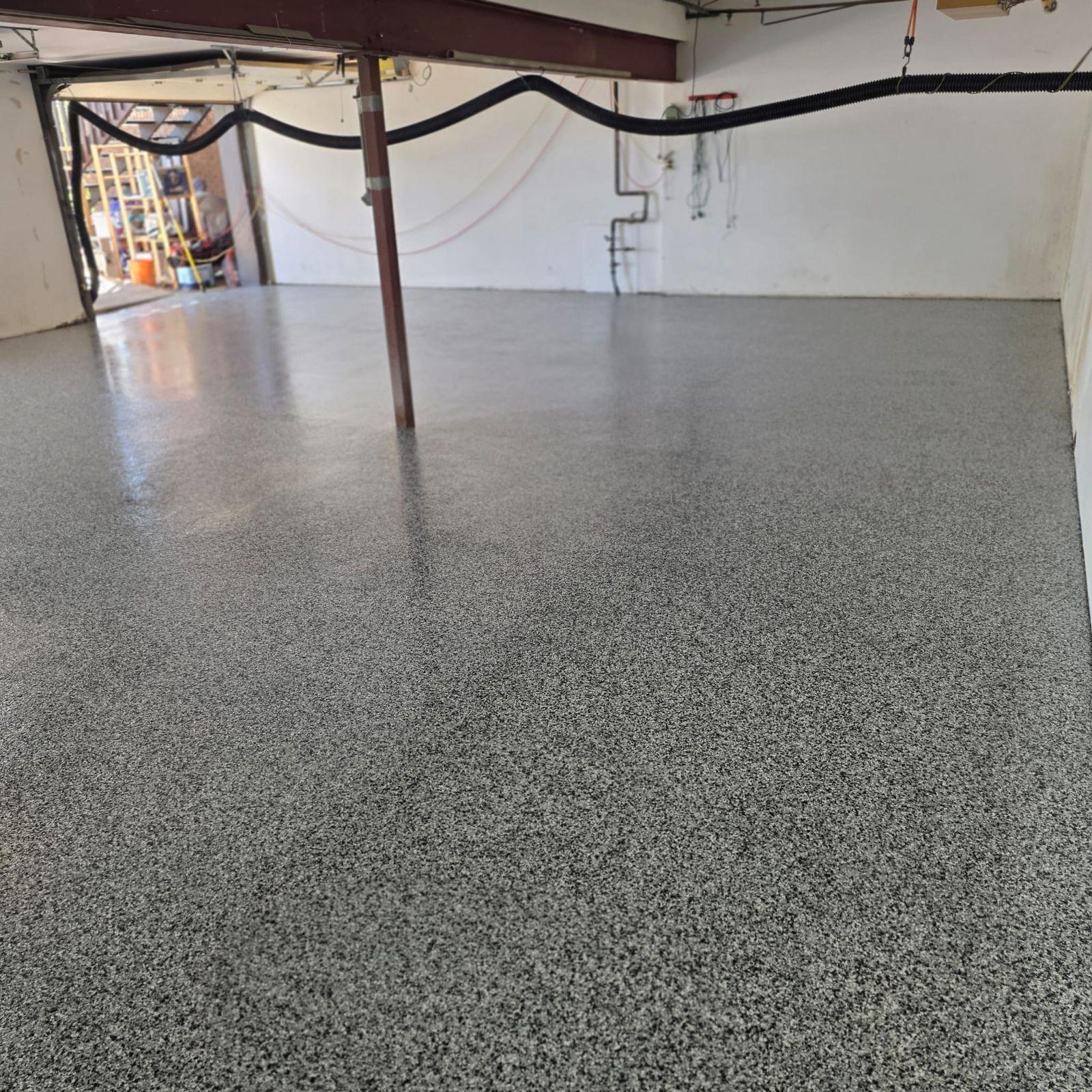 Completed flake epoxy garage floor by Res-Tech Concrete