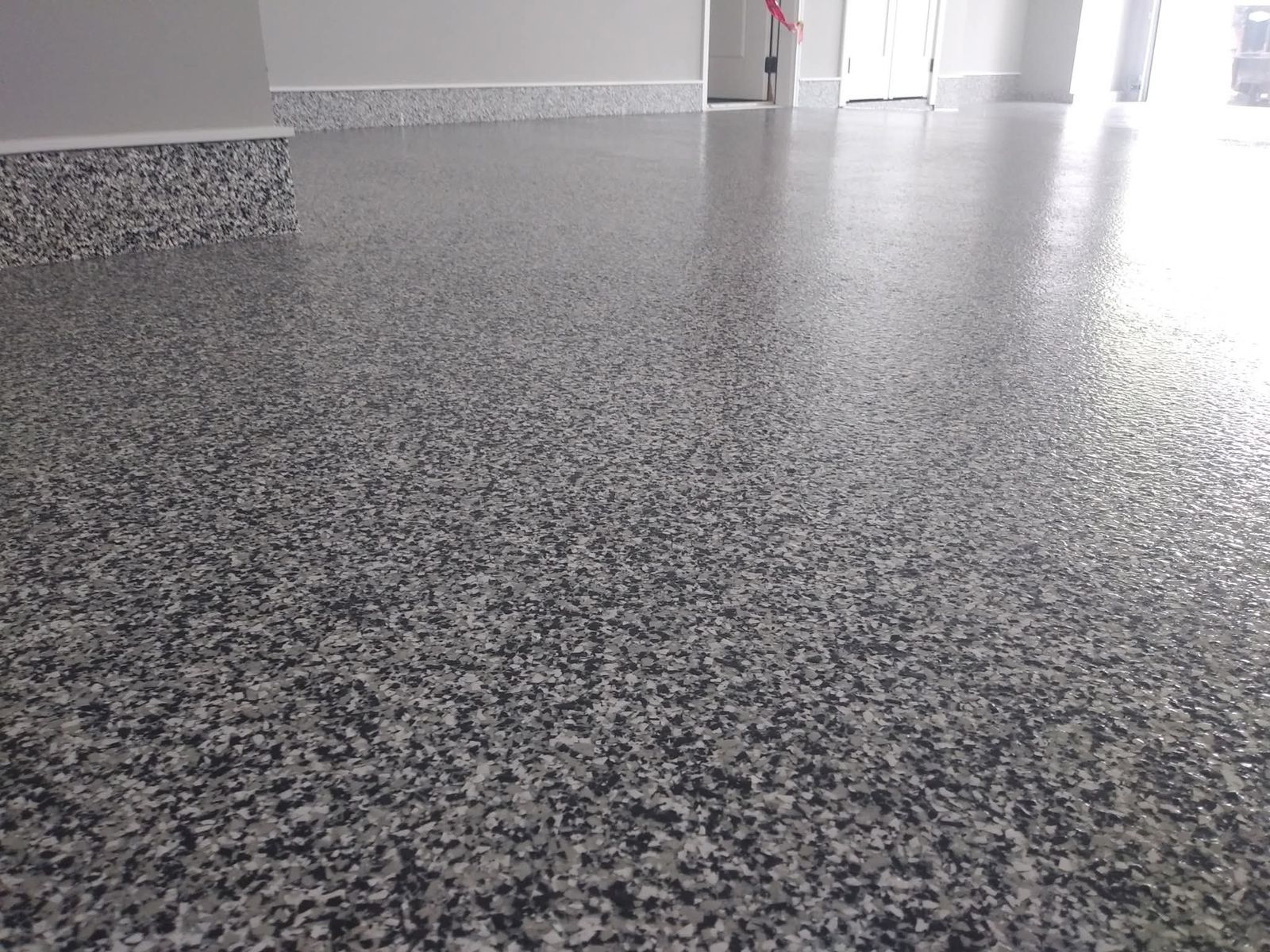 Close-up of premium flake epoxy floor finish installed by Res-Tech Concrete
